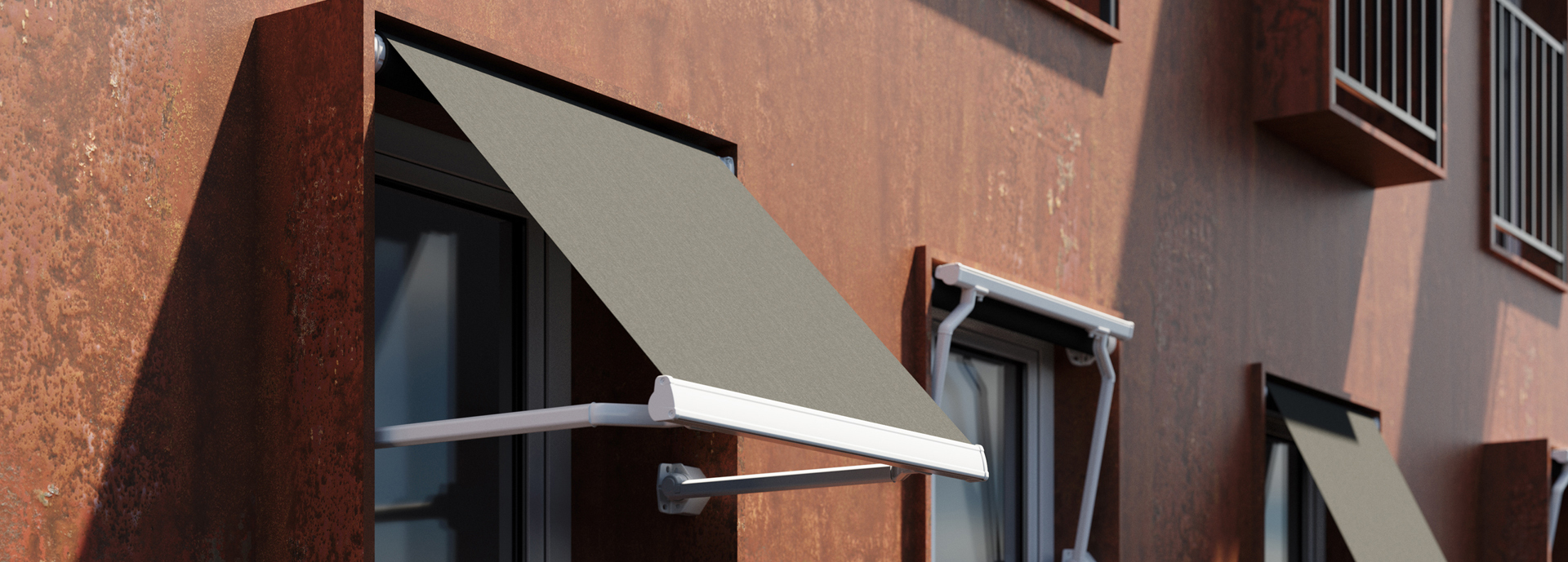 Store avec bras droit à projection verticale, préconisés pour la protection solaire de bâtiments avec fenêtres sans balcon.