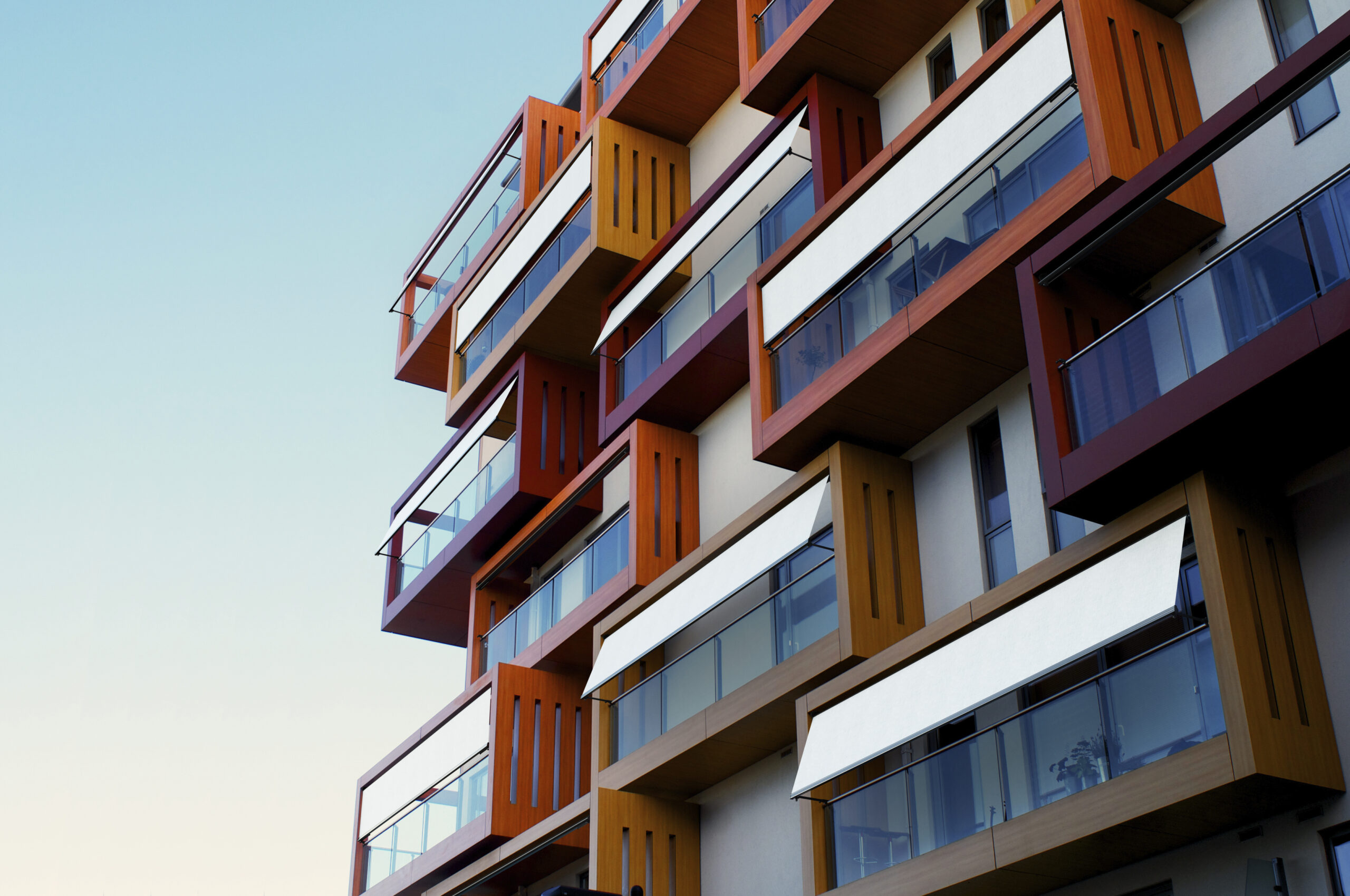 Balconies of a modern luxury apartments with a blue sky